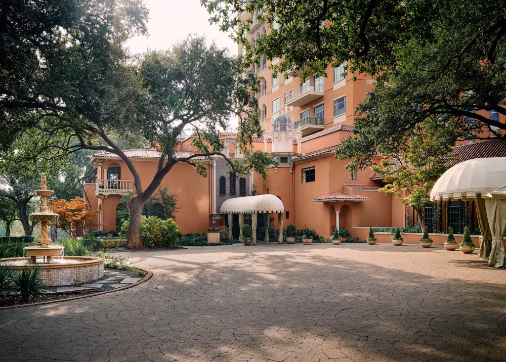 Historic exterior façade and red tiled roof of Rosewood Mansion on Turtle Creek in Dallas